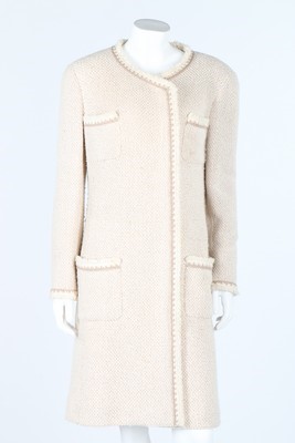 Lot 29 - A Chanel beige and ivory silk/wool tweed coat,...