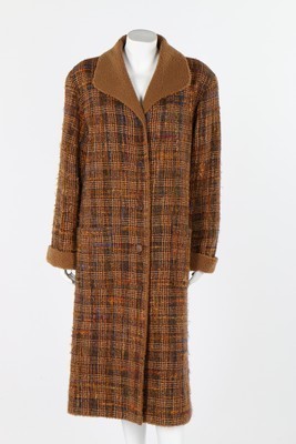 Lot 38 - A Chanel brown tweed coat and matching jacket,...