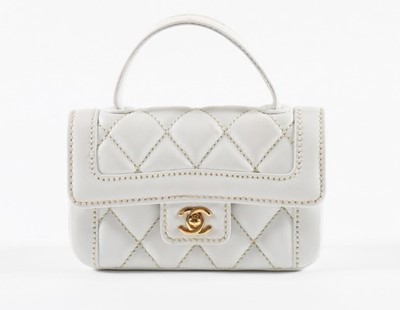 Lot 39 - A Chanel white quilted leather summer bag,...