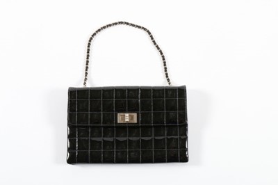 Lot 40 - A Chanel quilted black patent handbag,...