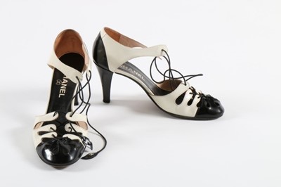 Lot 44 - Three pairs of Chanel black and white shoes,...