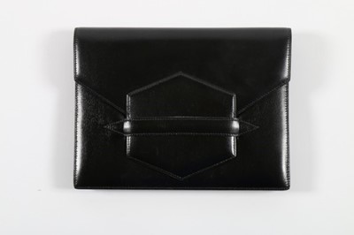 Lot 49 - An Hermès black leather clutch bag, 1980s,...