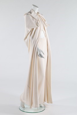 Lot 185 - A Madame Grès couture ivory crpe cape and...