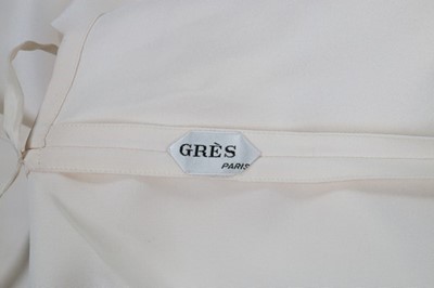 Lot 185 - A Madame Grès couture ivory crpe cape and...