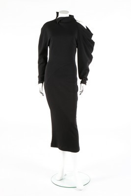 Lot 180 - A Claude Montana black jersey evening gown,...