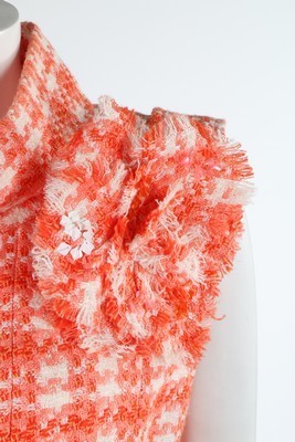 Lot 28 - A Chanel orange and white tweed ensemble, 2001,...