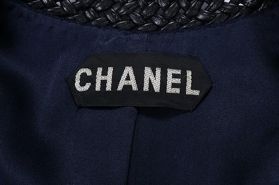 Lot 37 - A Chanel couture navy wool suit, SS 1992,...