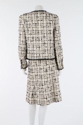 Lot 31 - A Chanel black and cream tweed suit, 2003,...