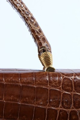 Lot 108 - A Gucci brown crocodile handbag, 1960s,...