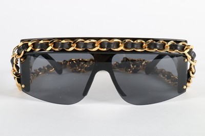 Lot 25 - A pair of Chanel sunglasses, 1991, the upper...