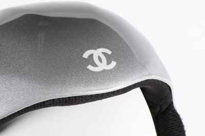 Lot 26 - A Chanel ski helmet, with silver finish, CC...