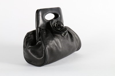 Lot 27 - A Chanel soft leather handbag with camelia...