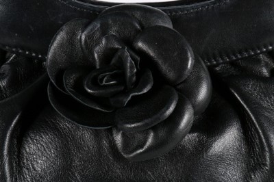 Lot 27 - A Chanel soft leather handbag with camelia...