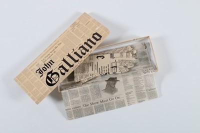 Lot 257 - A pair of John Galliano newspaper print...