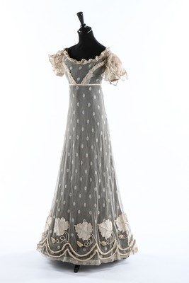 Lot 48 - A tamboured net dress, circa 1825, embroidered...