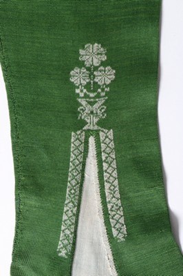 Lot 40 - A pair of frame-knitted green silk stockings,...