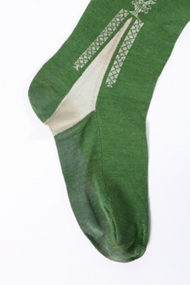 Lot 40 - A pair of frame-knitted green silk stockings,...