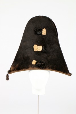 Lot 41 - A tall bicorne hat, circa 1800, of black...