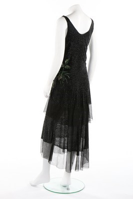 Lot 64 - A tiered bugle beaded evening gown, circa 1929,...