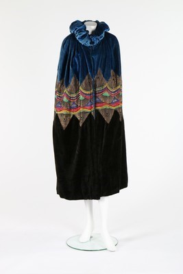 Lot 63 - A velvet and lamé opera cape, mid 1920s, of...