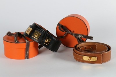 Lot 12 - Two Hermès belts, one of tan leather with a...