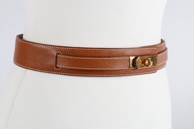 Lot 12 - Two Hermès belts, one of tan leather with a...