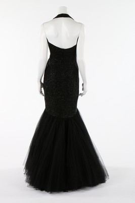 Lot 103 - A black beaded tulle couture evening gown,...