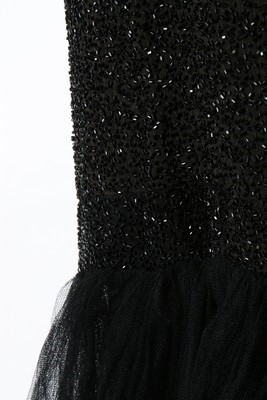 Lot 103 - A black beaded tulle couture evening gown,...
