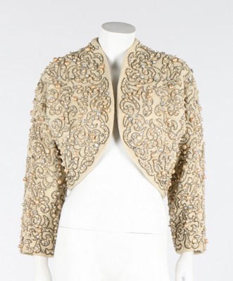 Lot 109 - An elaborately beaded couture evening jacket,...