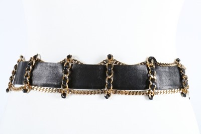 Lot 21 - A Chanel leather and chain belt, stamped...