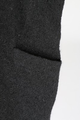 Lot 107 - A Balenciaga couture black boucl wool 'sack'...