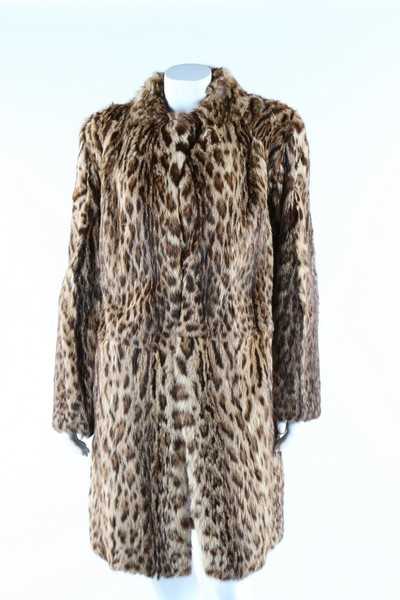 Lot 56 - A baby leopard skin coat, 1944, with original...