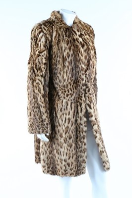 Lot 56 - A baby leopard skin coat, 1944, with original...