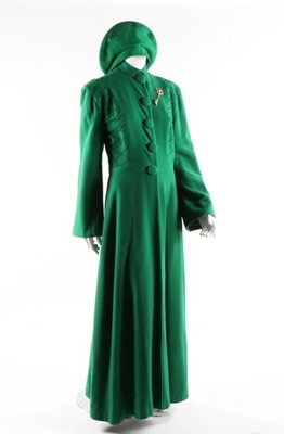 Lot 62 - A full-length green wool evening coat with...