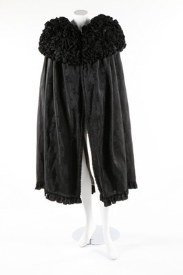 Lot 63 - An unusual black figured silk cape with...