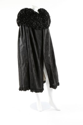 Lot 63 - An unusual black figured silk cape with...