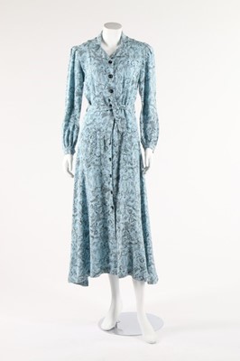Lot 102 - A Naomi labelled printed wool hostess gown,...