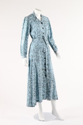 Lot 102 - A Naomi labelled printed wool hostess gown,...