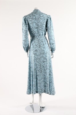 Lot 102 - A Naomi labelled printed wool hostess gown,...