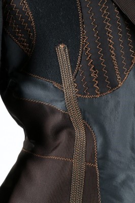 Lot 105 - A Jean Paul Gaultier black satin and brown pin-...