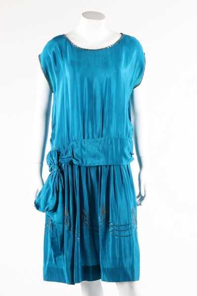 Lot 111 - A petrol-blue crepe dress with silver beading...