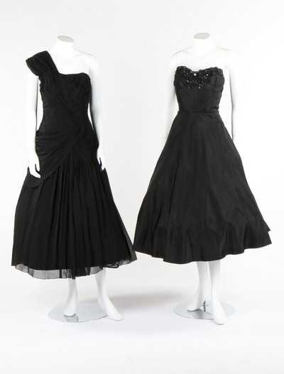 Lot 115 - Black and white evening gowns, including a...