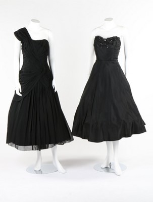 Lot 115 - Black and white evening gowns, including a...