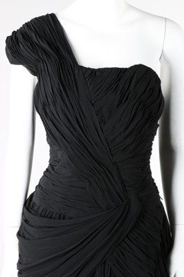 Lot 115 - Black and white evening gowns, including a...