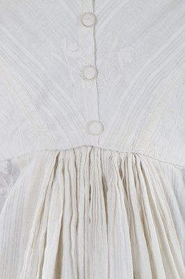 Lot 119 - A whitework embroidered empire-line muslin...