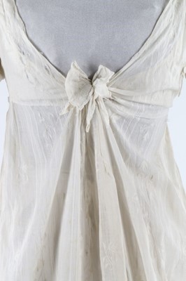 Lot 119 - A whitework embroidered empire-line muslin...