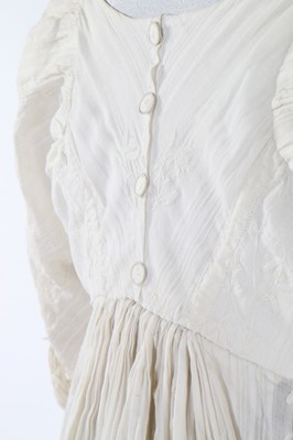 Lot 119 - A whitework embroidered empire-line muslin...