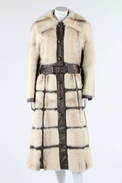 Lot 121 - A mink coat with brown leather trim, circa...