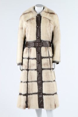 Lot 121 - A mink coat with brown leather trim, circa...