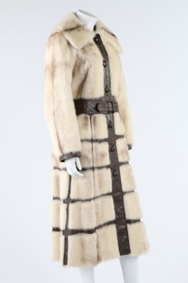 Lot 121 - A mink coat with brown leather trim, circa...